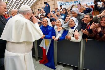 Pope Francis at lectern